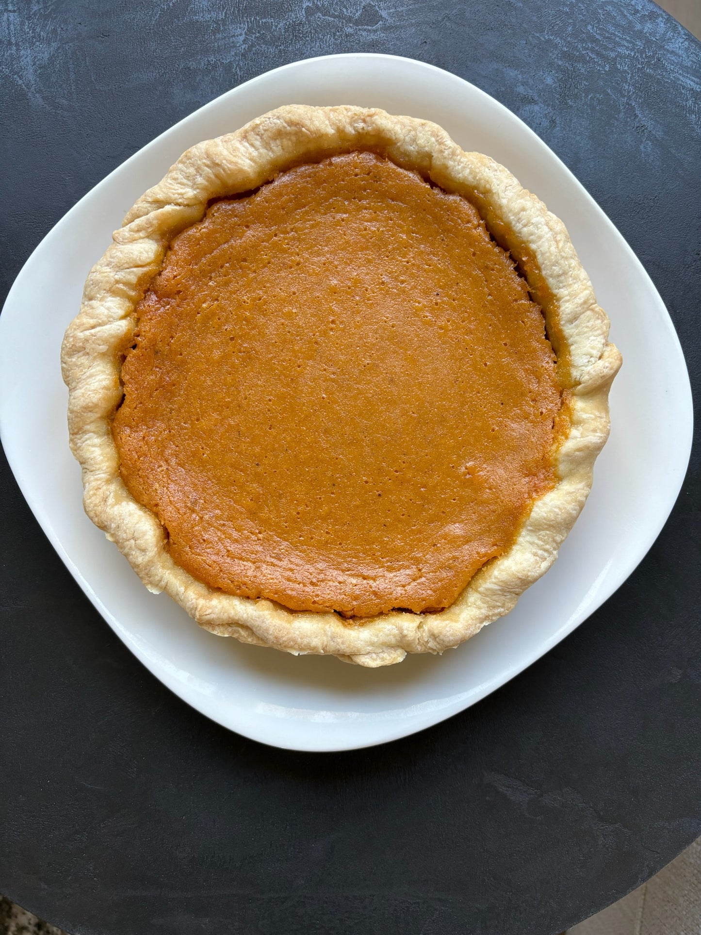 (Large) creamy sweet potato filling baked in Jess signature butter crust.