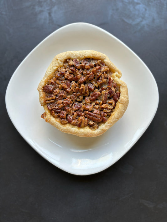 Luscious maple pecan filling nestled in Jess signature butter crust.