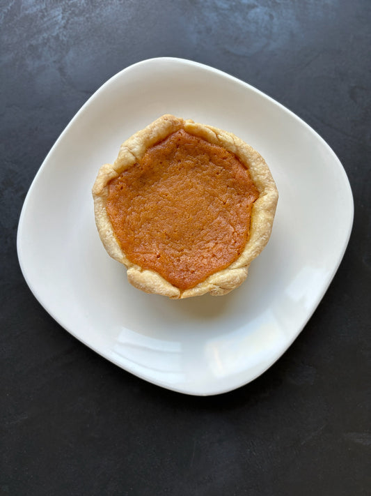 Creamy sweet potato filling baked in Jess signature butter crust.