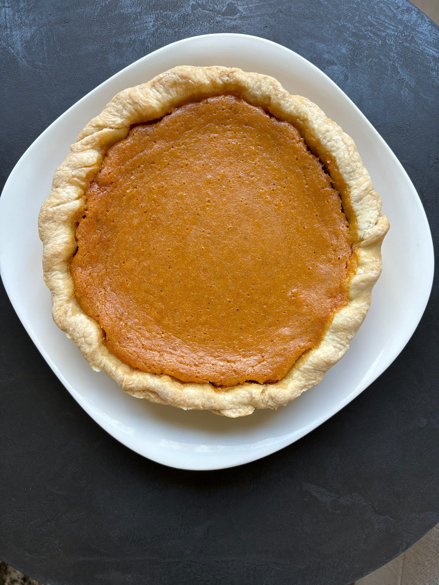(Large) creamy sweet potato filling baked in Jess signature butter crust.